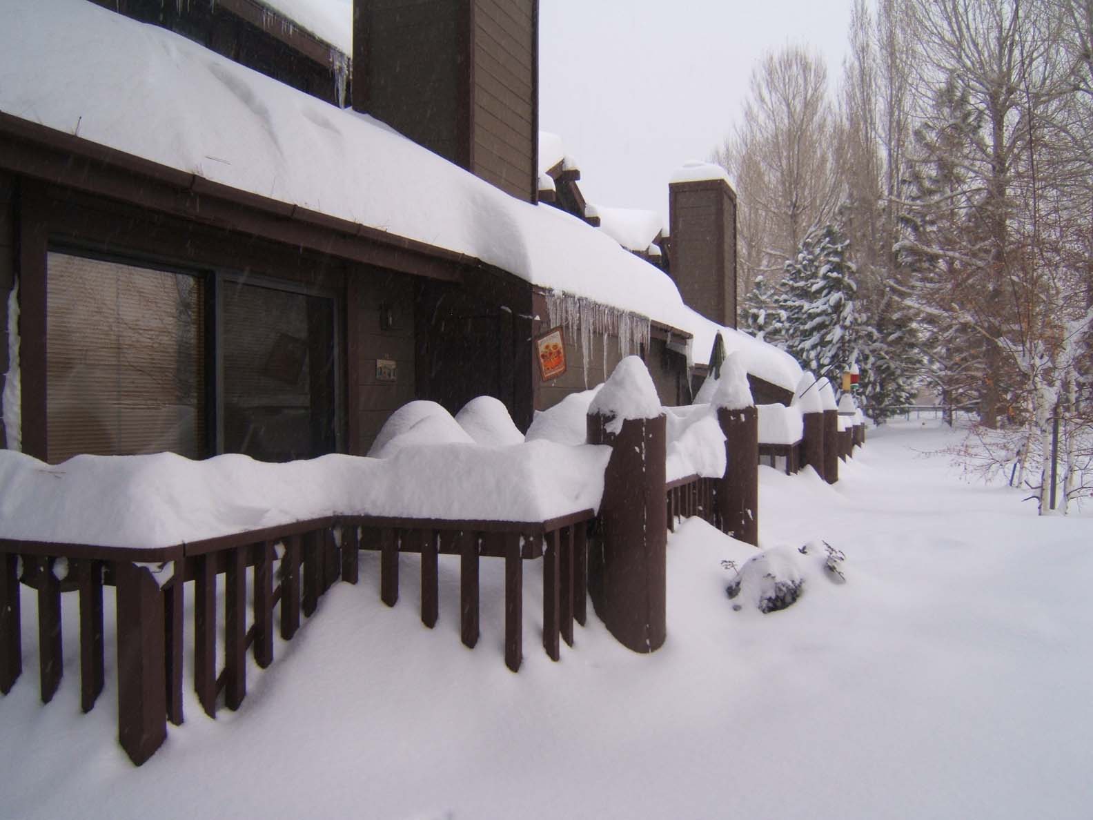 Snow piling up over the decks and railings